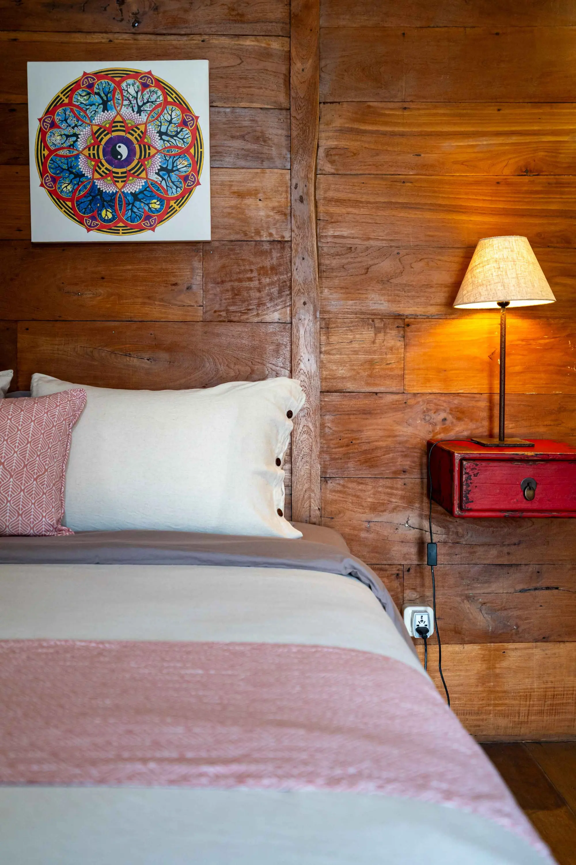 Evening inside the Joglo — lamplight on old timber walls